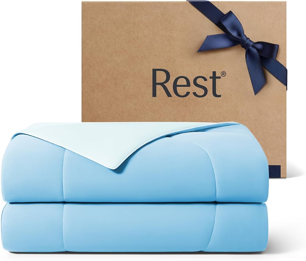 Rest Evercool Cooling Comforter folded on white bedding
